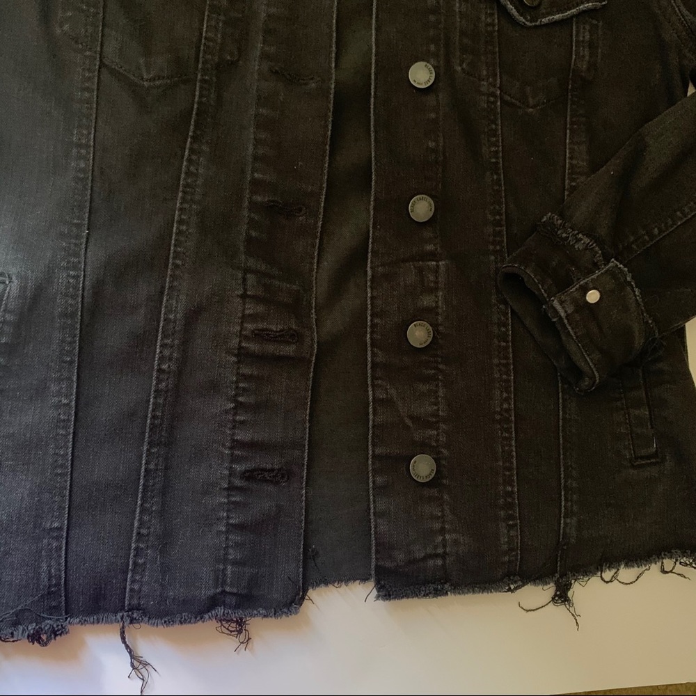 Distressed denim jacket